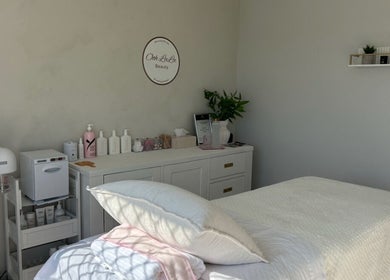 Calming treatment room at Ooh Lala Beauty in Redland Bay, Queensland, AU, featuring a pristine massage bed.