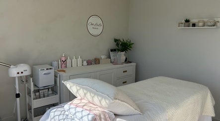 Calming treatment room at Ooh Lala Beauty in Redland Bay, Queensland, AU, featuring a pristine massage bed.