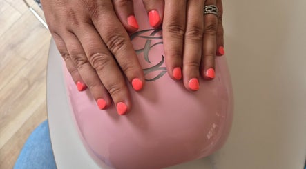 Bright coral nails under LED at Nails with Carly, Great Bookham, England, GB for a chic look.