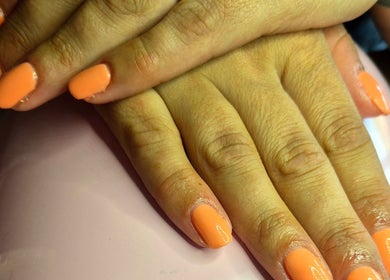Fresh peach-colored manicure at Nails with Carly, Great Bookham, England, GB. Elegant nail design.