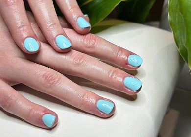 Stylish aqua nails at Anna Paints Nails in Bracon Ash, England, GB. Perfect manicure close-up.