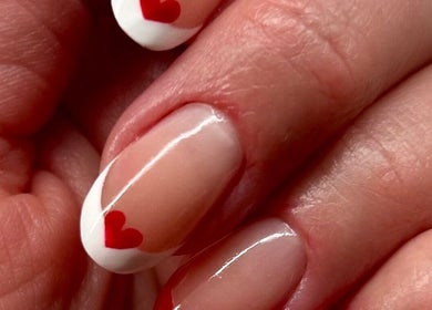 Close-up of a heart-accented manicure at Anna Paints Nails, Bracon Ash, England, GB.