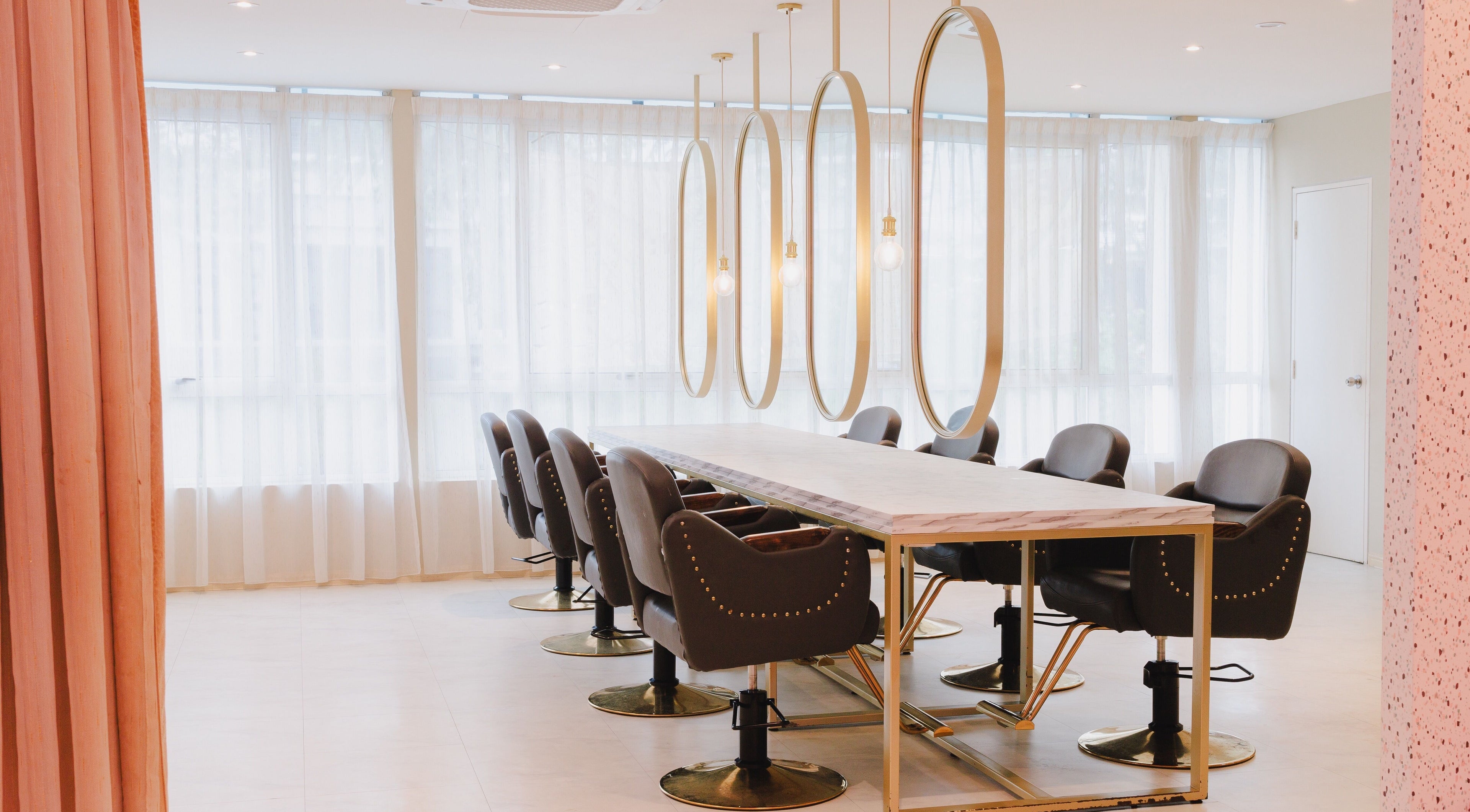 Elegant salon chairs and mirrors at Aurora Muslimah Salon & Spa Bukit Rimau in Shah Alam, Selangor, MY.