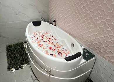 Luxurious tub with rose petals at Aurora Muslimah Salon & Spa Bukit Rimau, Shah Alam, Selangor, MY.