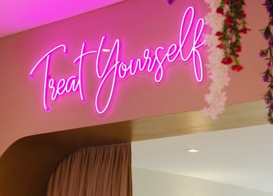 Neon sign 'Treat Yourself' at Aurora Muslimah Salon & Spa Bukit Rimau, Shah Alam, Selangor, MY.