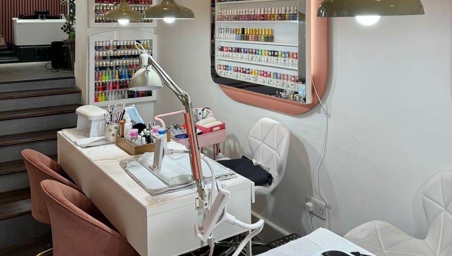 Elegant nail station at Lyttle Minx II Nails & Beauty, London, England, GB. Modern decor with diverse polish selection.