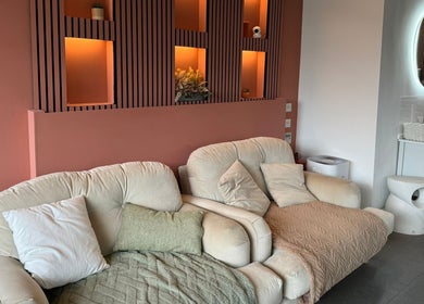 Comfortable seating area at Lyttle Minx II Nails & Beauty in London, England, GB with elegant decor.