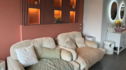 Comfortable seating area at Lyttle Minx II Nails & Beauty in London, England, GB with elegant decor.