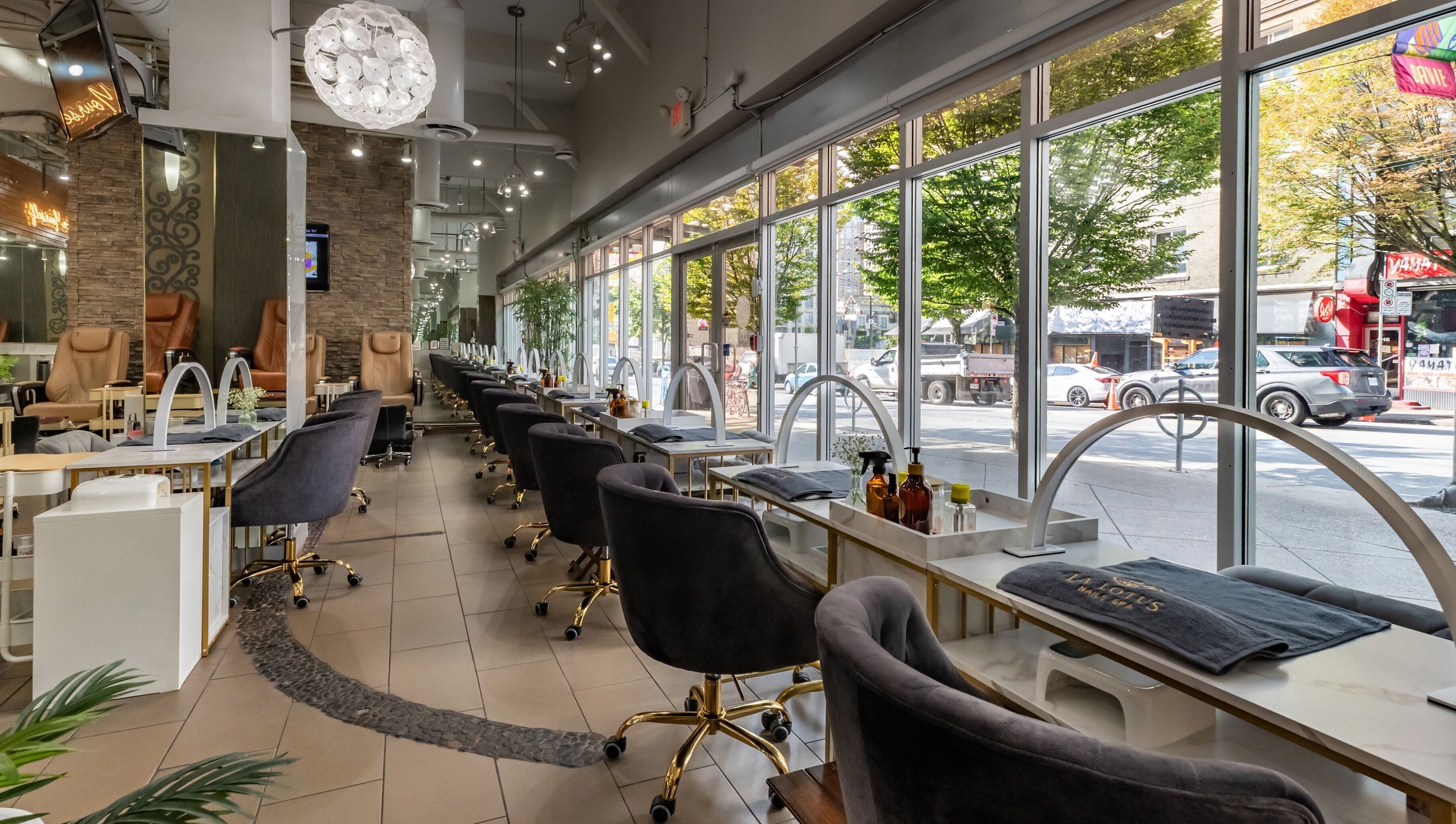 Modern interior of La Lotus Nails Spa in Vancouver, British Columbia, CA with plush chairs and elegant decor.