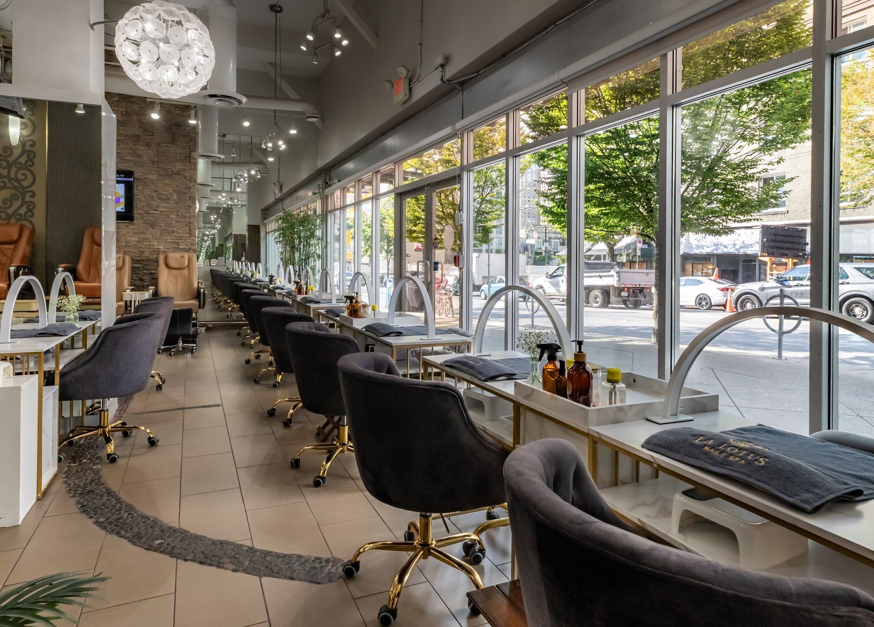 Modern interior of La Lotus Nails Spa in Vancouver, British Columbia, CA with plush chairs and elegant decor.