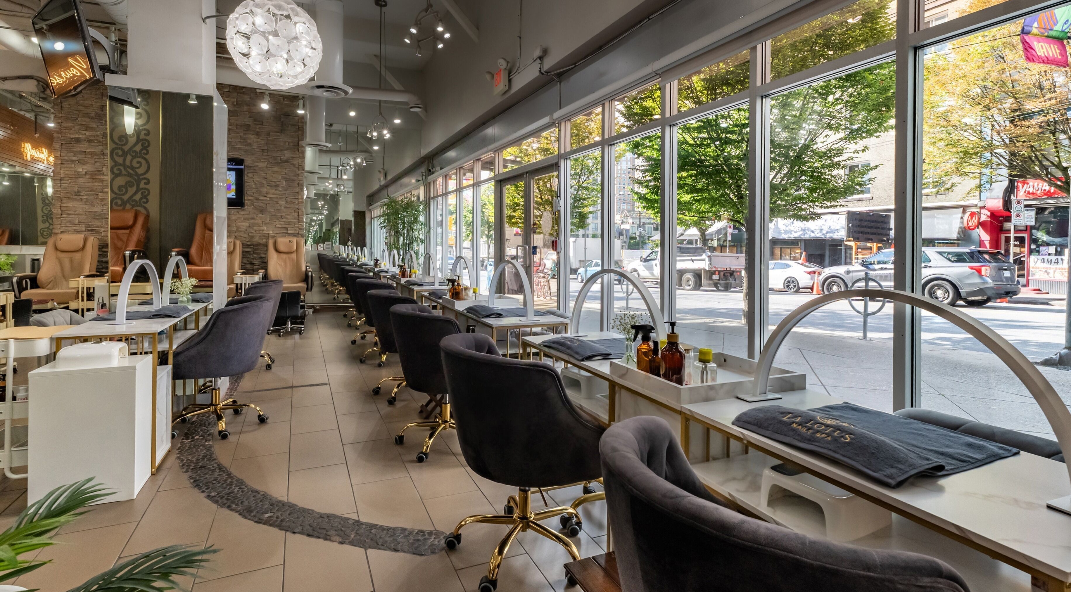Modern interior of La Lotus Nails Spa in Vancouver, British Columbia, CA with plush chairs and elegant decor.