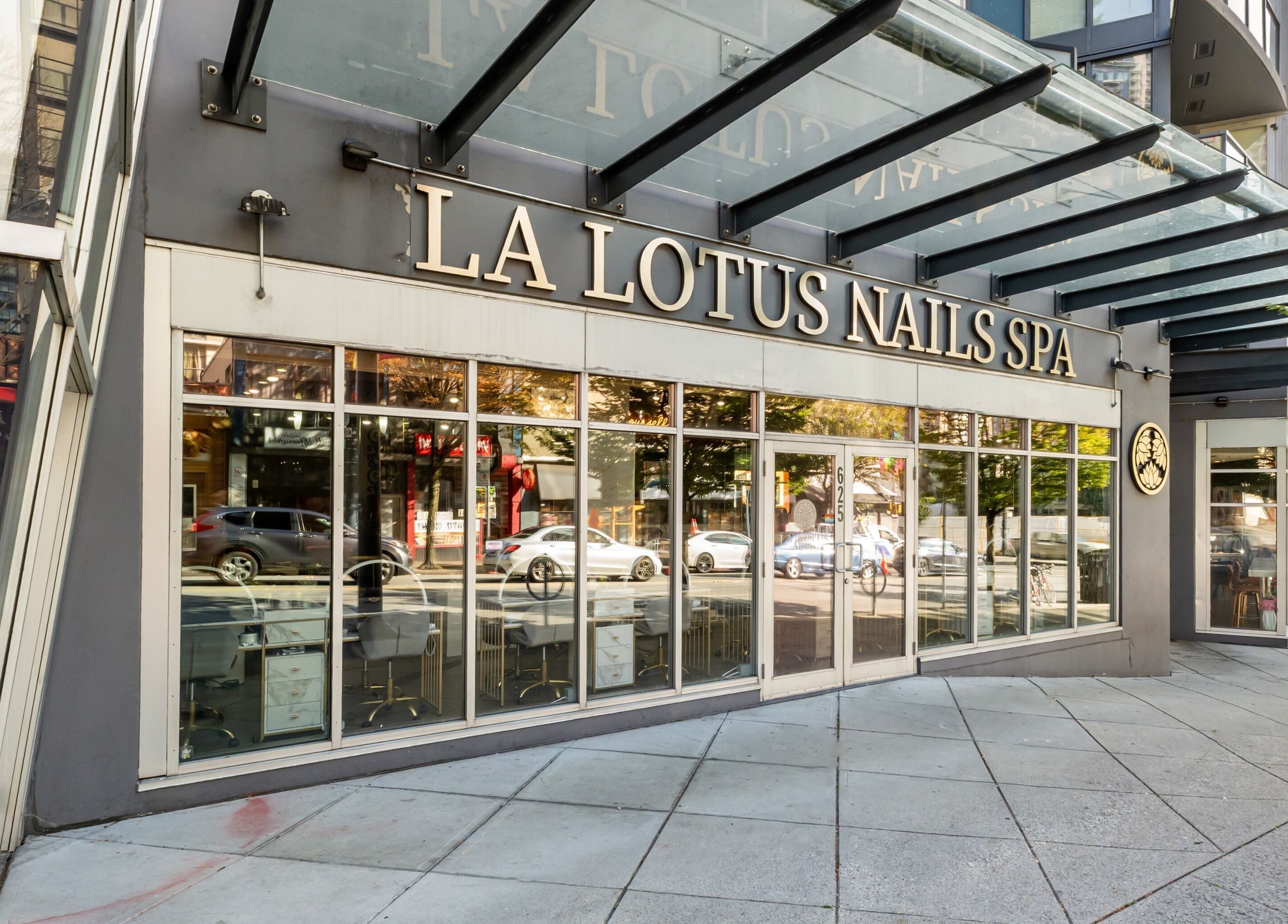 Front entrance of La Lotus Nails Spa in Vancouver, British Columbia, CA, featuring modern glass facade.