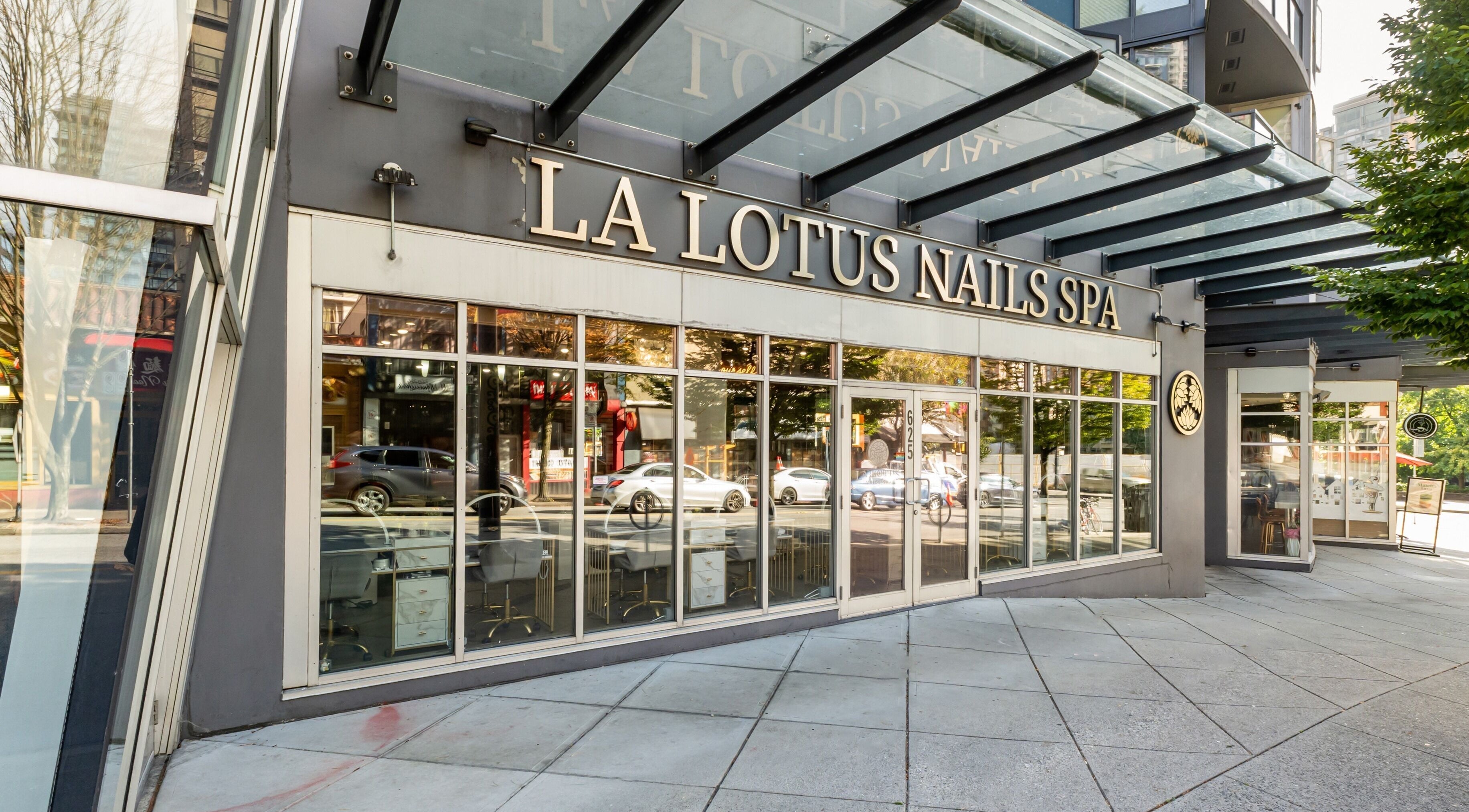 Front entrance of La Lotus Nails Spa in Vancouver, British Columbia, CA, featuring modern glass facade.