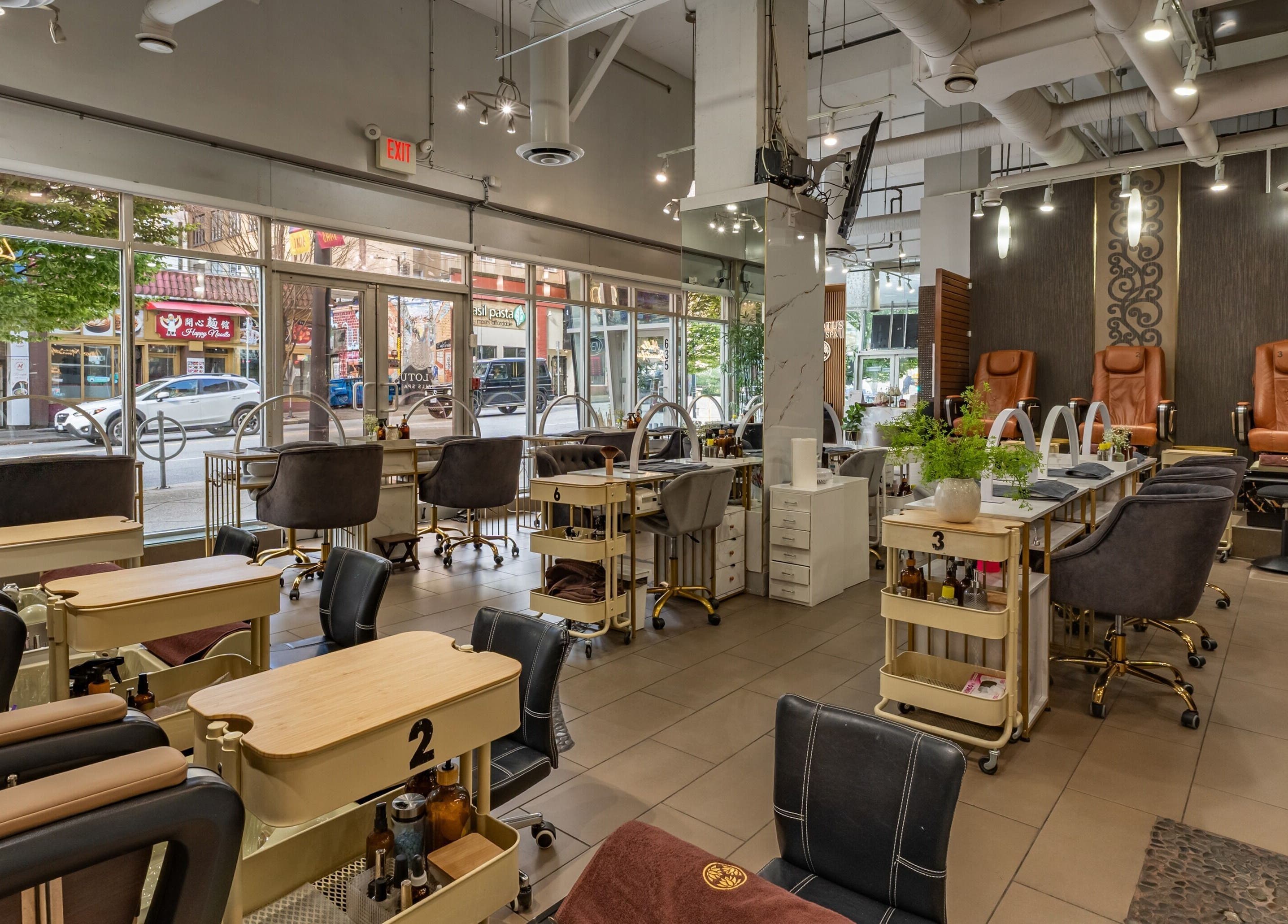 Interior view of La Lotus Nails Spa in Vancouver, British Columbia, CA, showcasing modern pedicure stations.