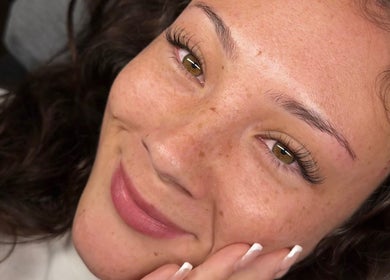 Close-up of a smiling woman with enhanced lashes at BLINX in Buckhurst Hill, England, GB.