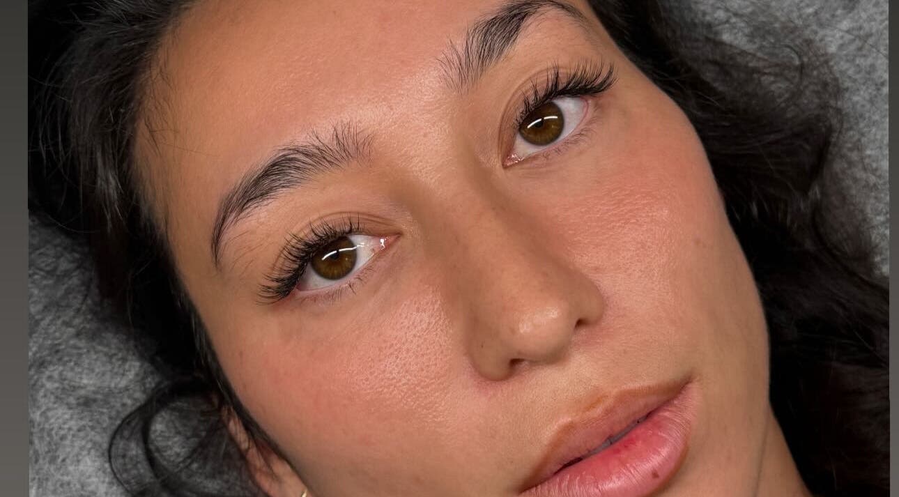 Close-up of a woman's enhanced eyelashes at Blinx, London, England, GB, showcasing beauty expertise.