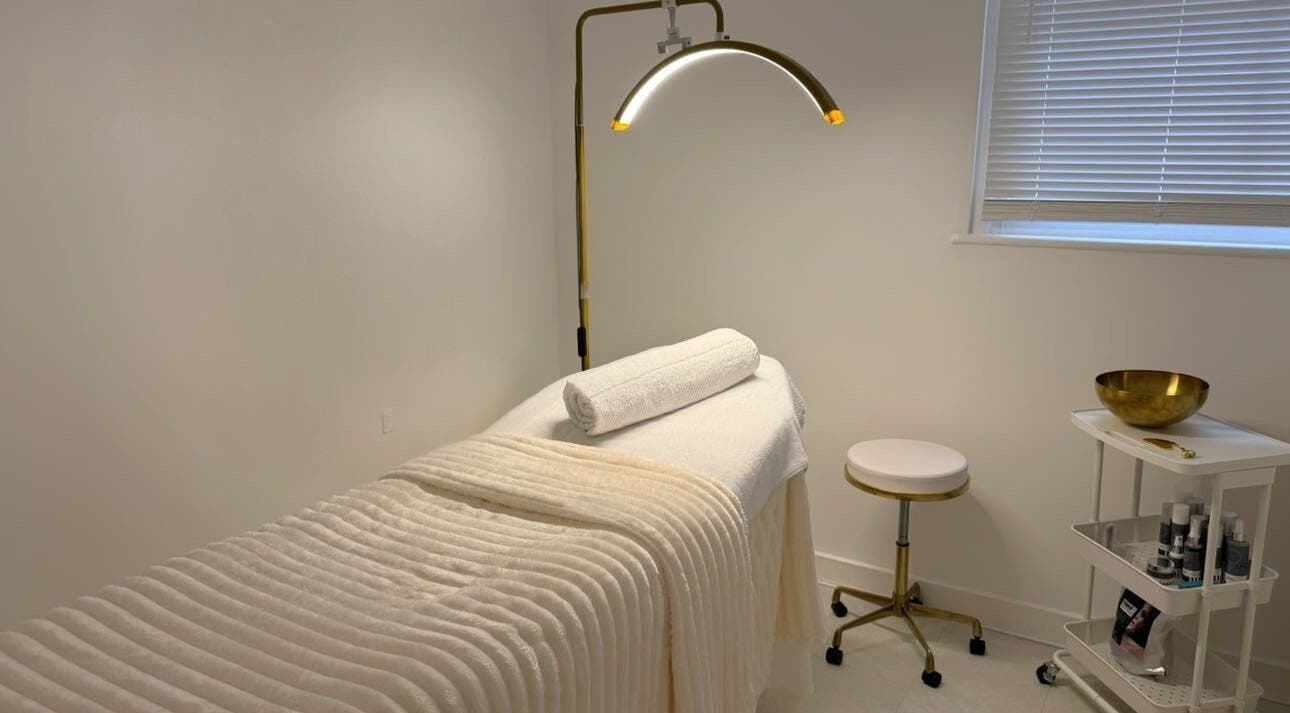 Relaxing spa treatment room at Blinx, London, England, GB with a massage bed and calming decor.