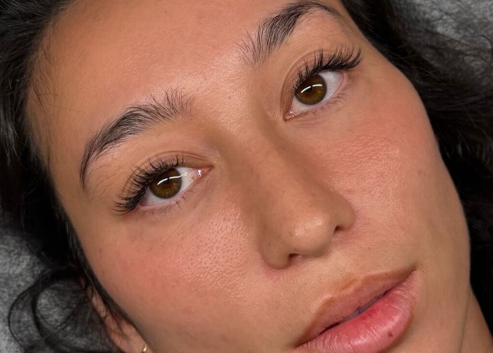 Close-up of eye with lush lashes at Blinx, London, England, GB, showcasing beauty service results.