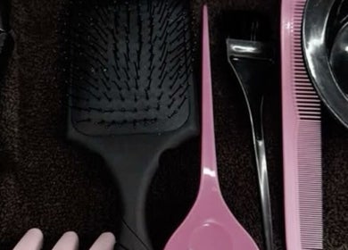 Hairbrush, comb, and clips at Slayedbyajblacc salon, Bristol, England, GB.
