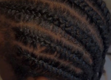 Stylish cornrows at Slayedbyajblacc, Bristol, England, GB. Expertly crafted intricate braids for all occasions.