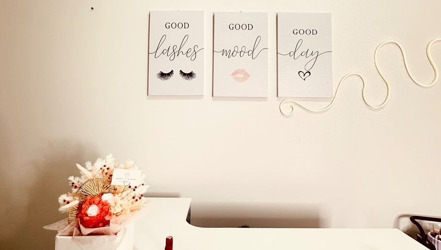 Elegant wall decor with lash-themed quotes at Sweetie Lash, Moorebank, New South Wales, AU.