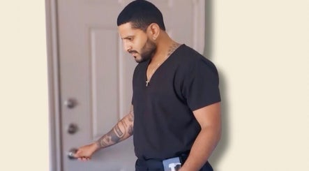 Person entering Strength & Touch Gym in Houston, Texas, US, showcasing modern gym attire.