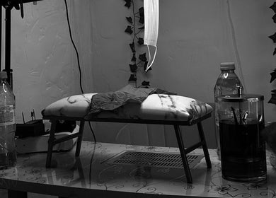 Nail station setup at The Pink Edit Co., London, England, GB featuring a cushioned rest and essential tools.