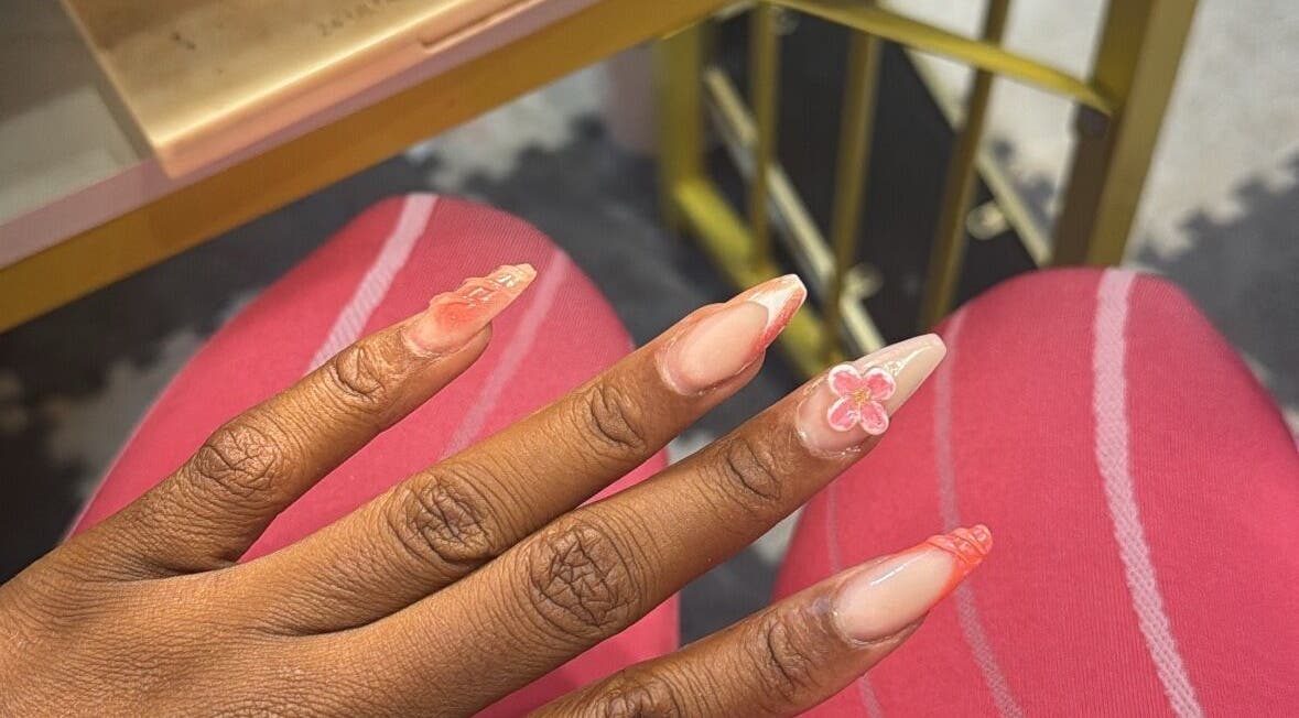 Nail art with pink floral design at The Pink Edit Co., London, England, GB showcasing creative manicure.