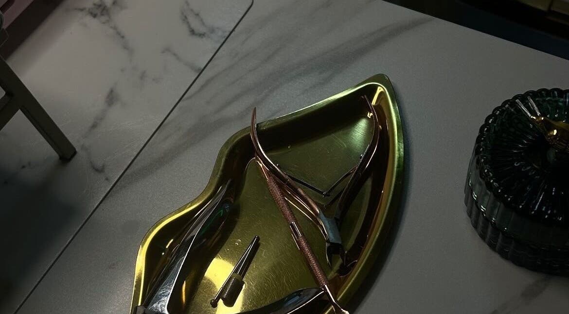 Gold manicure tools in a tray at The Pink Edit Co., London, England, GB.