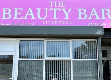 Front facade of The Beauty Bar Liverpool in Liverpool, England, GB with prominent pink signage.