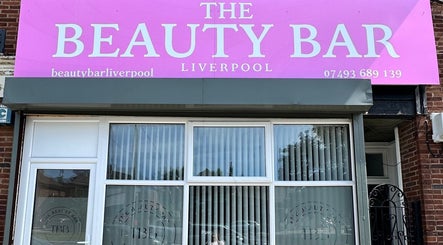 Front facade of The Beauty Bar Liverpool in Liverpool, England, GB with prominent pink signage.
