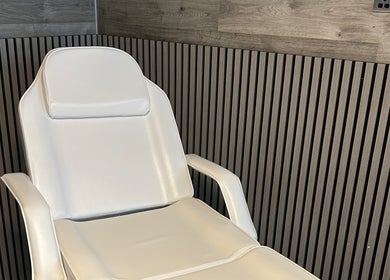 Elegant white recliner chair at The Beauty Bar Liverpool, Liverpool, England, GB, offering comfort and style.
