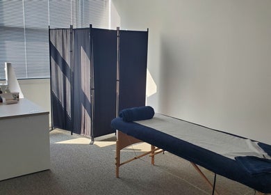 Massage room at The Reboot Room, Camberley, England, GB with table and calming decor.
