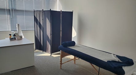 Massage room at The Reboot Room, Camberley, England, GB with table and calming decor.