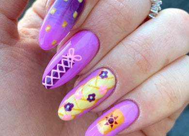 Colorful nail art featuring floral patterns at Pears Gels, Durham, England, GB.