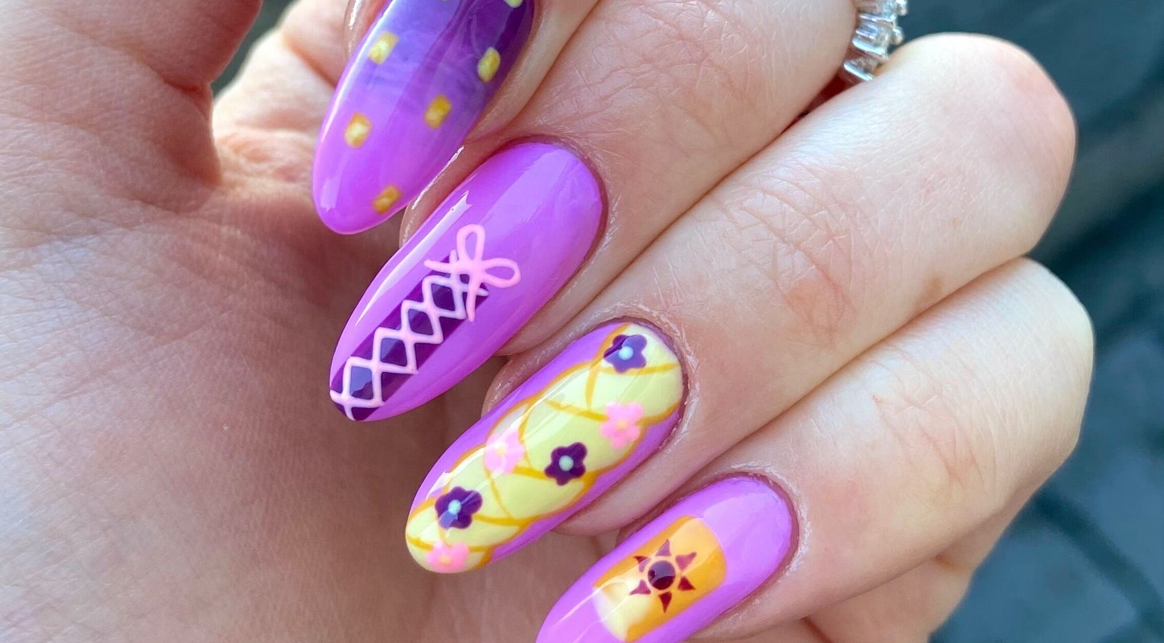 Colorful nail art featuring floral patterns at Pears Gels, Durham, England, GB.
