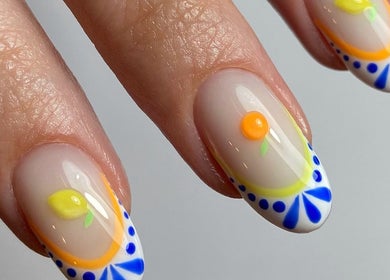 Creative citrus-themed nail art design at Pears Gels, Durham, England, GB, featuring vibrant colors.