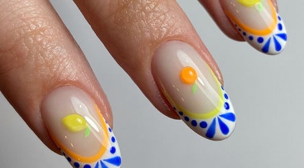 Creative citrus-themed nail art design at Pears Gels, Durham, England, GB, featuring vibrant colors.
