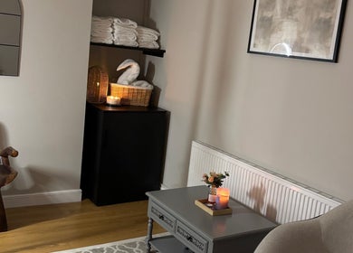 Ambient room at Sirinthra Beauty & Massage, Blackburn, England, with elegant decor and warm lighting.