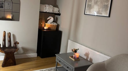 Ambient room at Sirinthra Beauty & Massage, Blackburn, England, with elegant decor and warm lighting.