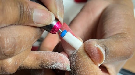 Close-up of a nail drill at Lu_Nailedit, Sheffield, England, GB, showcasing expert manicure techniques.
