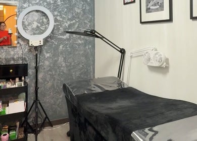 Cozy lash extension room at Zoe Lashes NYC, New York, New York, US, featuring professional tools and decor.