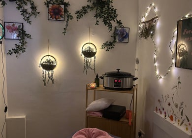Warm, cozy massage room at A.M.B.E.R Aromatherapy and Massage, Dalkeith, Scotland, GB, featuring illuminated decor.
