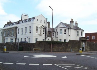 Historic white building, Glow Method Crawley, Crawley, England, GB, showcasing beautiful architecture.