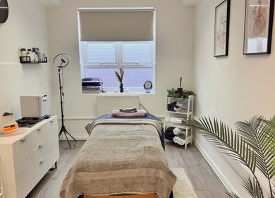 Calming treatment room at Glow Method Crawley in Crawley, England, GB, featuring a cozy massage table.