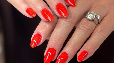 Vibrant red manicure at Laque Nail Bar, Vancouver, British Columbia, CA. Elegant nails polished to perfection.