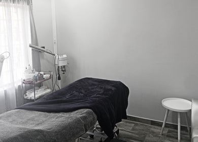 Tranquil treatment room at M Beauty, Alberton, Gauteng, ZA featuring a cozy massage bed and serene decor.