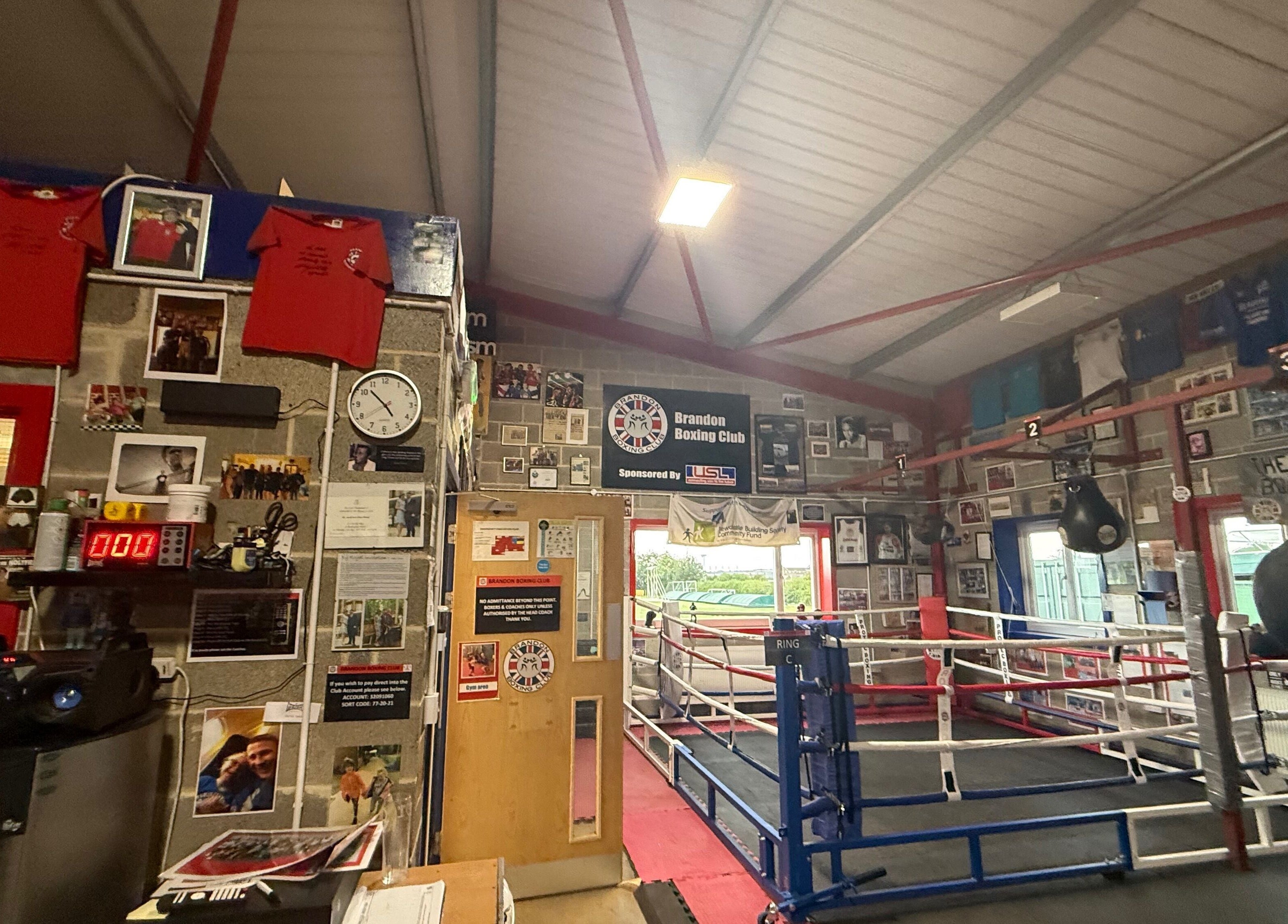 Interior of Train With TNT, Brandon, England, GB, showcasing boxing ring and memorabilia-filled walls