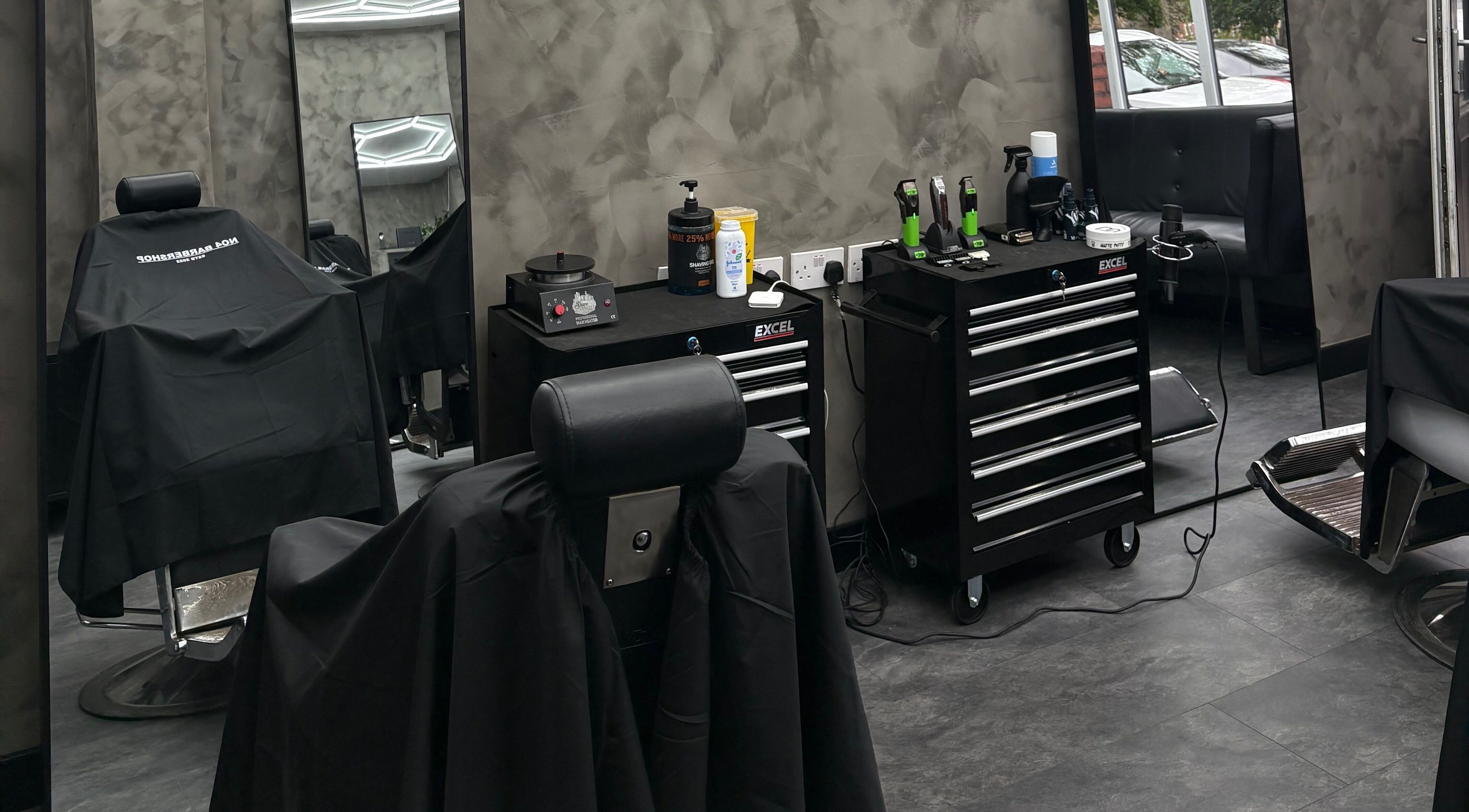Modern barber station at No4 Barbershop in Bredbury, England, GB with sleek tools and stylish setup.