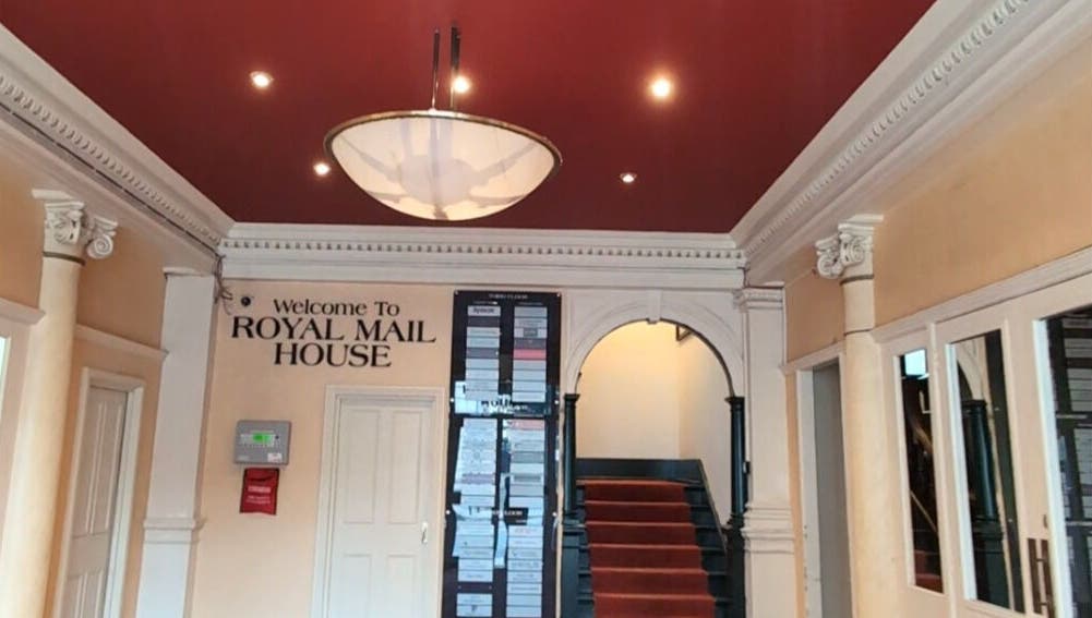 Elegant lobby of Renewal Integrative Rehab in Southampton, England, GB with rich red ceiling and welcome sign.